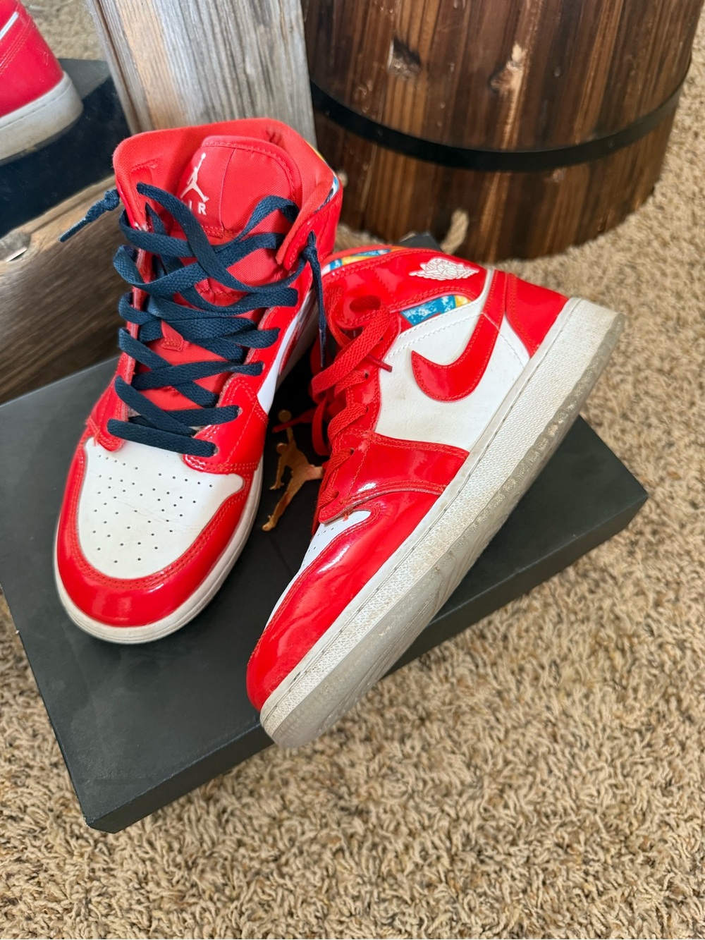 Jordan women’s High-Top Sneakers in Red, White and Black